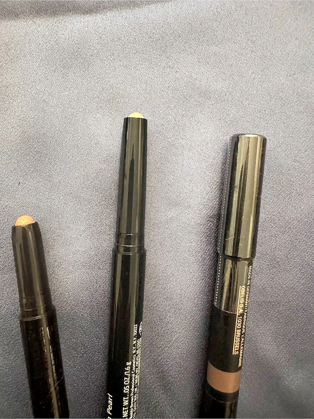 Bobbi Brown Sun Pearl, Nudestix taupe, and delux Laura Mercier eyeshadow crayons